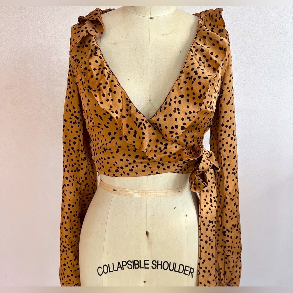 Club L- Printed ruffle blouse- size US 8. Mannequin is size 6. Adjustable (wrap)